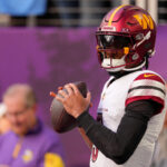 Dec 7, 2025; Minneapolis, Minnesota, USA; Washington Commanders quarterback Jayden Daniels (5) practices before the game at U.S. Bank Stadium. Mandatory Credit: Brad Rempel-Imagn Images