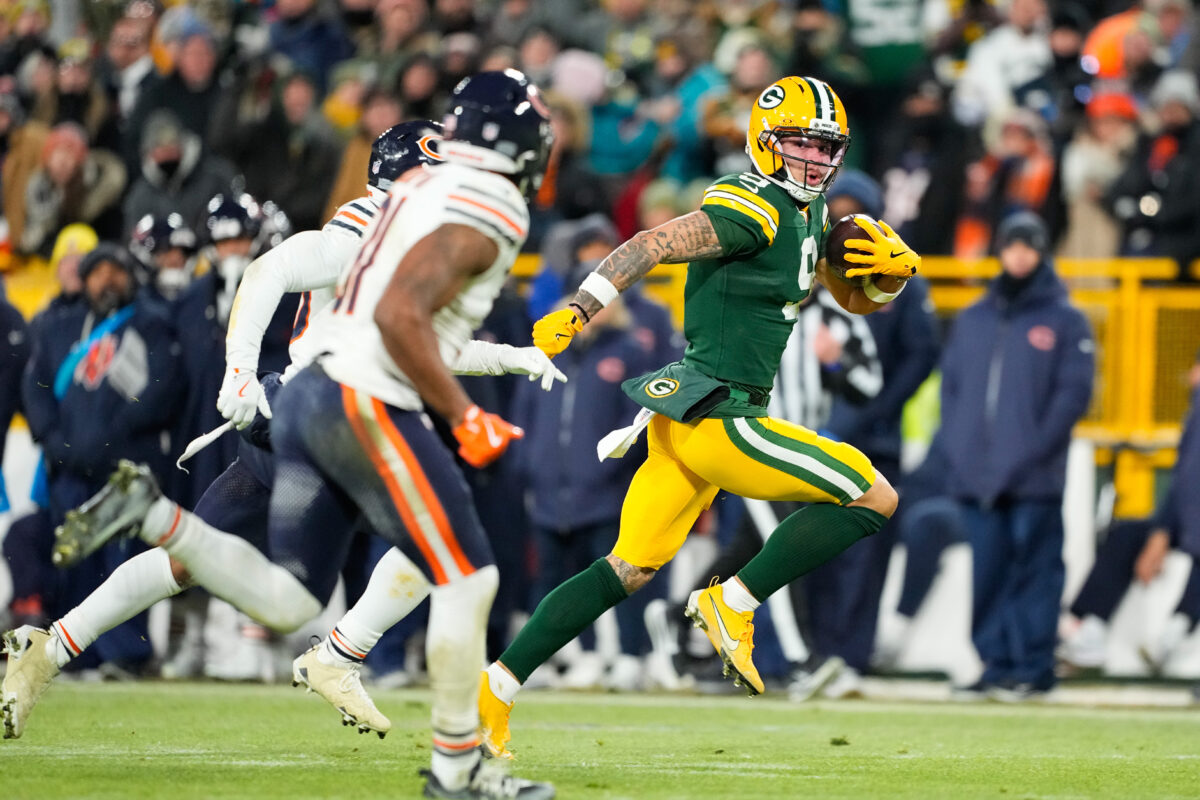 Packers Bears Dec 7, 2025; Green Bay, Wisconsin, USA; Green Bay Packers wide receiver Christian Watson (9) runs with the ball during the third quarter against the Chicago Bears at Lambeau Field. Mandatory Credit: Jeff Hanisch-Imagn Images