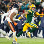 Packers Bears Dec 7, 2025; Green Bay, Wisconsin, USA; Green Bay Packers wide receiver Christian Watson (9) runs with the ball during the third quarter against the Chicago Bears at Lambeau Field. Mandatory Credit: Jeff Hanisch-Imagn Images