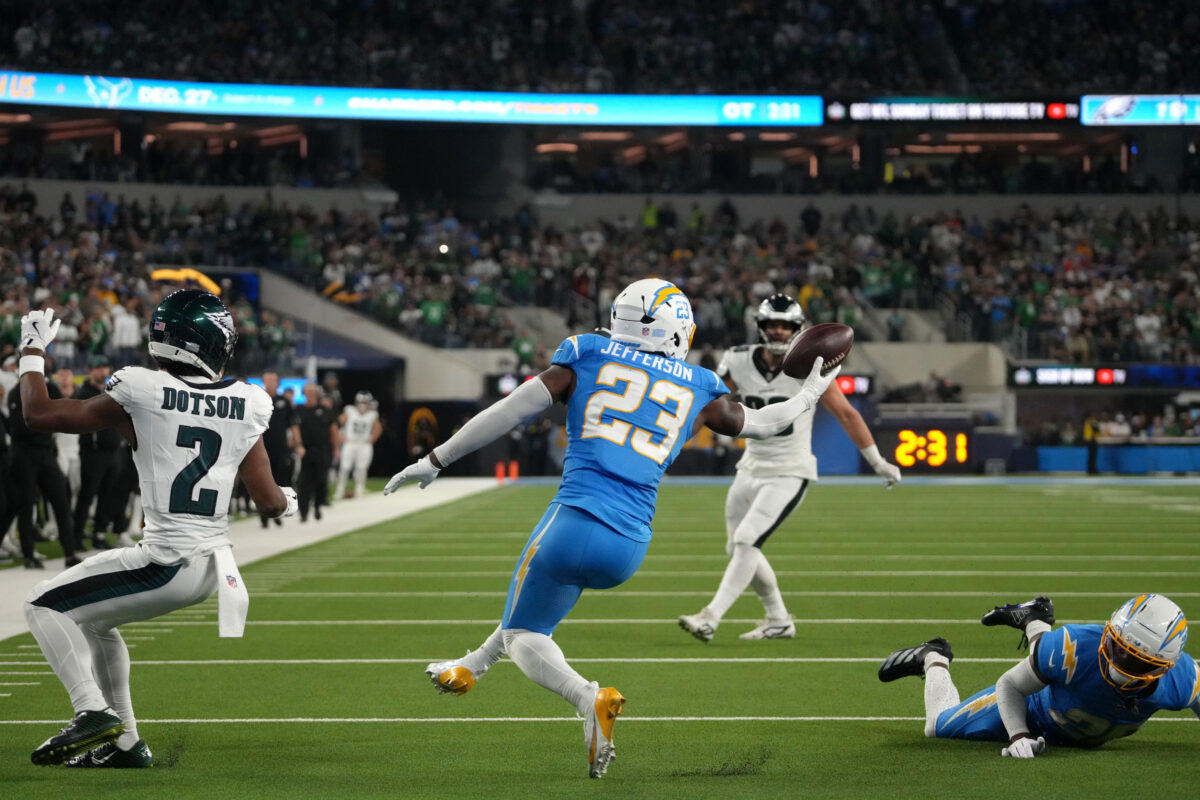 Dec 8, 2025; Inglewood, California, USA; Los Angeles Chargers safety Tony Jefferson (23) intercepts the ball against Philadelphia Eagles wide receiver Jahan Dotson (2) in overtime at SoFi Stadium. Mandatory Credit: Kirby Lee-Imagn Images