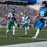 Jacksonville Jaguars quarterback Trevor Lawrence (16) scores a touchdown on a keeper during the first quarter of an NFL football matchup at EverBank Stadium, Sunday, Dec. 14, 2025, in Jacksonville, Fla. [Corey Perrine/Florida Times-Union]