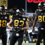 Dec 15, 2025; Pittsburgh, Pennsylvania, USA; Pittsburgh Steelers tight end/fullback Connor Heyward (83) celebrates with tight end Pat Freiermuth (88) and tight end Darnell Washington (80) after scoring a touchdown in the second quarter at Acrisure Stadium. Mandatory Credit: Charles LeClaire-Imagn Images