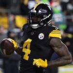 Dec 15, 2025; Pittsburgh, Pennsylvania, USA; Pittsburgh Steelers wide receiver DK Metcalf (4) scores a touchdown in the third quarter against the Miami Dolphins at Acrisure Stadium. Mandatory Credit: Charles LeClaire-Imagn Images