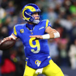 Dec 18, 2025; Seattle, Washington, USA; Los Angeles Rams quarterback Matthew Stafford (9) passes against the Seattle Seahawks in the first half at Lumen Field. Mandatory Credit: Kevin Ng-Imagn Images