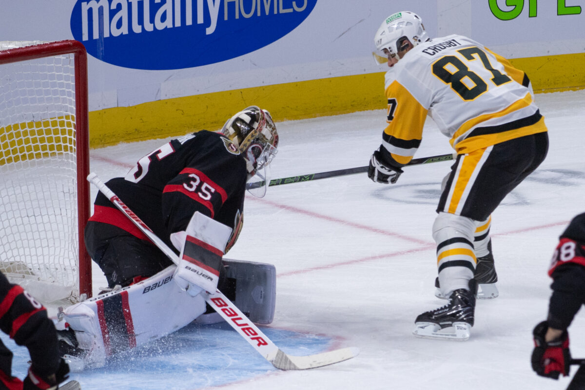 Dec 18, 2025; Ottawa, Ontario, CAN; Ottawa Senators goalie Linus Ullmark (35) makes a save on a shot from Pittsburgh Penguins center Sidney Crosby (97) in the third period at the Canadian Tire Centre. Mandatory Credit: Marc DesRosiers-IMAGN Images