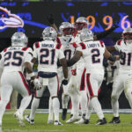 Dec 21, 2025; Baltimore, Maryland, USA; New England Patriots cornerback Marcus Jones (25) celebraets a fumble recovery with teammates during the second half of the game against the Baltimore Ravens at M&T Bank Stadium. Mandatory Credit: James Lang-Imagn Images