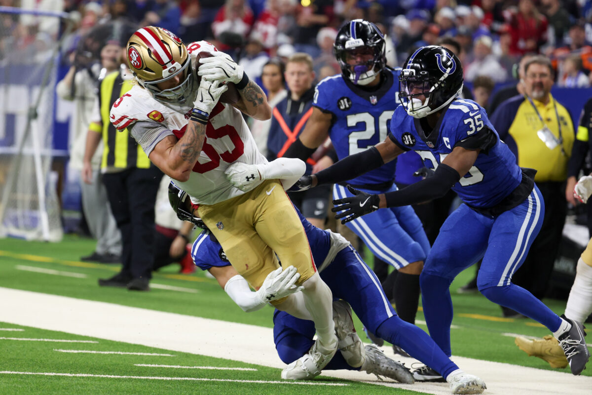 Dec 22, 2025; Indianapolis, Indiana, USA; Indianapolis Colts safety Cam Bynum (0) tackles San Francisco 49ers tight end George Kittle (85) in the third quarter of the game at Lucas Oil Stadium. Mandatory Credit: Trevor Ruszkowski-Imagn Images