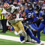 Dec 22, 2025; Indianapolis, Indiana, USA; Indianapolis Colts safety Cam Bynum (0) tackles San Francisco 49ers tight end George Kittle (85) in the third quarter of the game at Lucas Oil Stadium. Mandatory Credit: Trevor Ruszkowski-Imagn Images