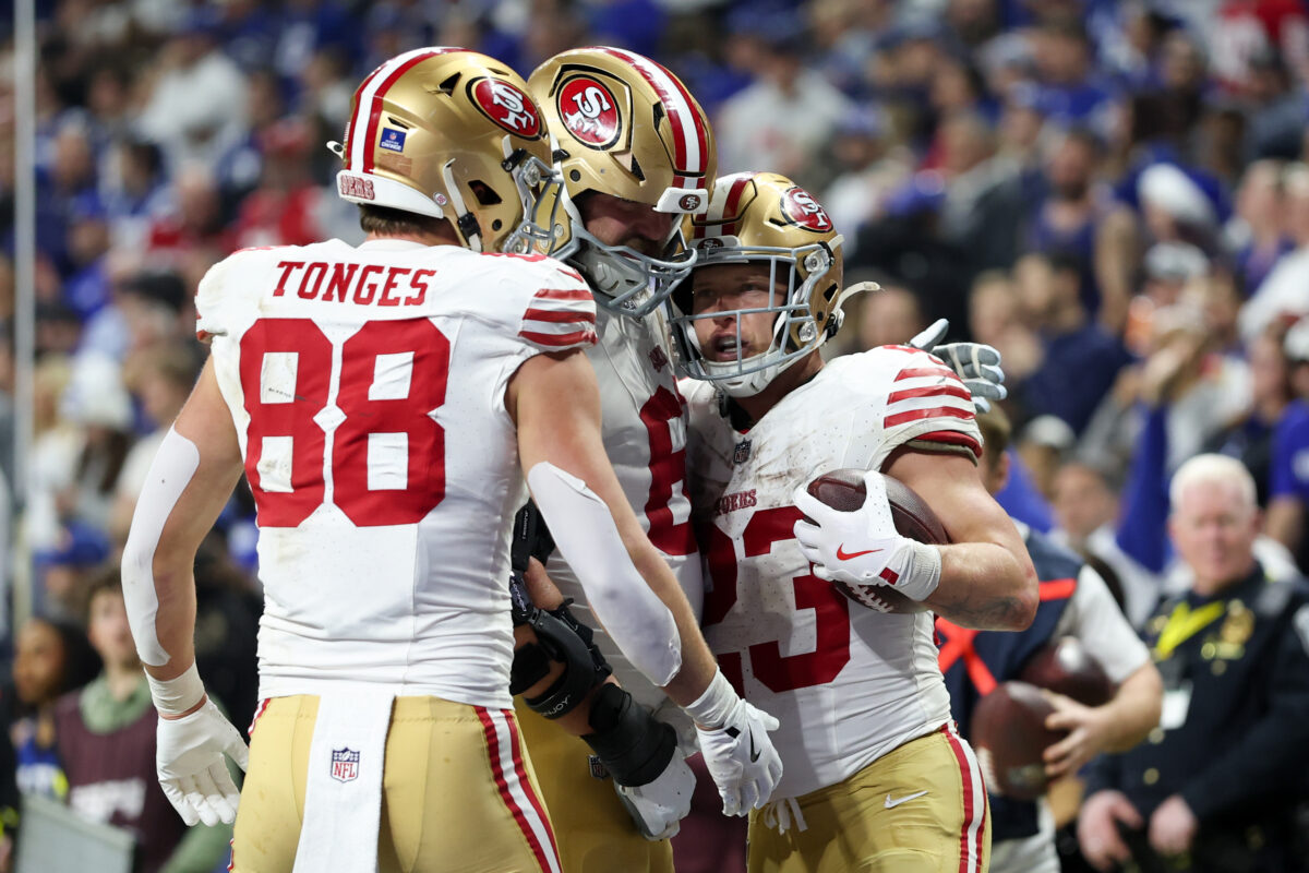 Dec 22, 2025; Indianapolis, Indiana, USA; San Francisco 49ers running back Christian McCaffrey (23) celebrates after scoring a touchdown against the Indianapolis Colts with tight end Jake Tonges (88) and fullback Kyle Juszczyk (44) in the fourth quarter of the game at Lucas Oil Stadium. Mandatory Credit: Trevor Ruszkowski-Imagn Images