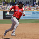 Mar 13, 2025; Port St. Lucie, Florida, USA; Boston Red Sox second base Vaughn Grissom (5) rounds third base and scores during the second inning against the New York Mets at Clover Park.