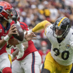 Oct 1, 2023; Houston, Texas, USA; Houston Texans quarterback C.J. Stroud (7) is chased by Pittsburgh Steelers linebacker T.J. Watt (90) in the second quarter at NRG Stadium. Mandatory Credit: Thomas Shea-USA TODAY Sports