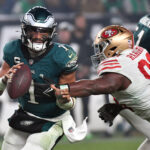 Dec 3, 2023; Philadelphia, Pennsylvania, USA; Philadelphia Eagles quarterback Jalen Hurts (1) is tackled by San Francisco 49ers defensive tackle Javon Hargrave (98) during the fourth quarter at Lincoln Financial Field. Mandatory Credit: Eric Hartline-USA TODAY Sports