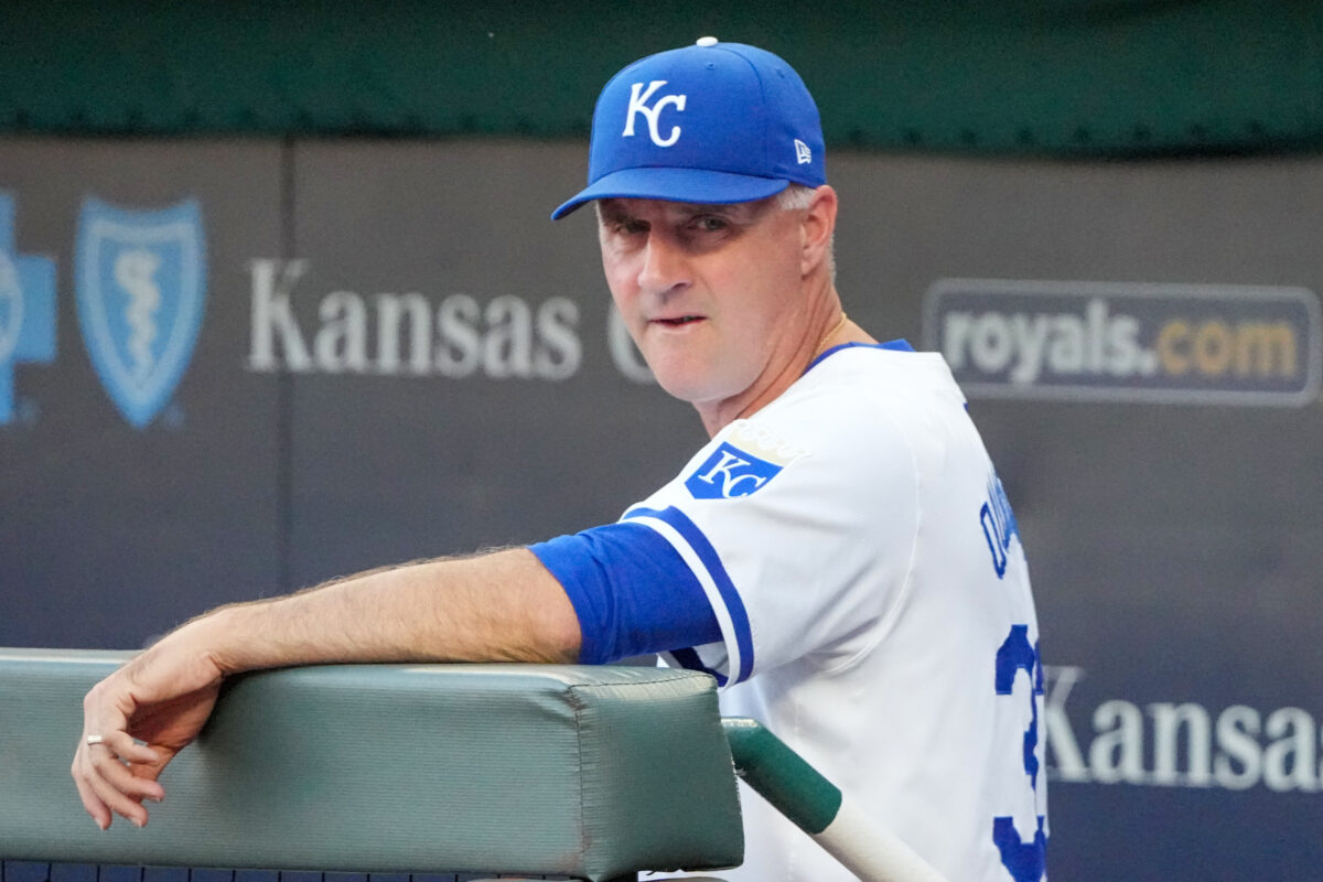 Sep 4, 2024; Kansas City, Missouri, USA; Kansas City Royals manager Matt Quatraro (33) watches from the dugout against the Cleveland Guardians prior to a game at Kauffman Stadium. Mandatory Credit: Denny Medley-Imagn Images