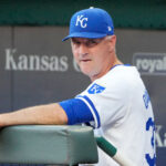 Sep 4, 2024; Kansas City, Missouri, USA; Kansas City Royals manager Matt Quatraro (33) watches from the dugout against the Cleveland Guardians prior to a game at Kauffman Stadium. Mandatory Credit: Denny Medley-Imagn Images