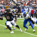 Sep 29, 2024; Chicago, Illinois, USA; Los Angeles Rams linebacker Jared Verse (8) chases Chicago Bears quarterback Caleb Williams (18) during the first half at Soldier Field. Mandatory Credit: Matt Marton-Imagn Images
