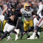 Nov 17, 2024; Chicago, Illinois, USA; Chicago Bears quarterback Caleb Williams (18) rolls out during the first quarter of their game against the Green Bay Packers Sunday, November 17, 2024 at Soldier Field in Chicago, Illinois. Mandatory Credit: Mark Hoffman/USA TODAY Network via Imagn Images