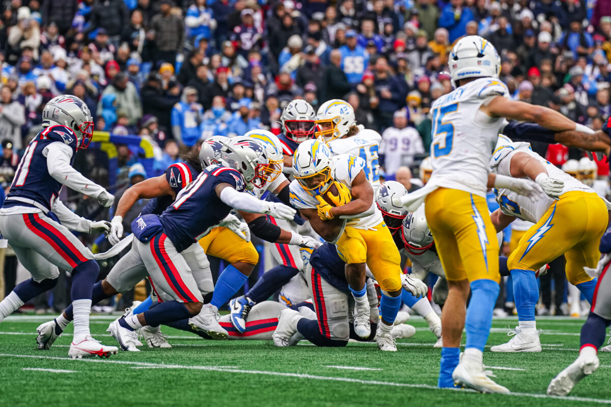 Dec 28, 2024; Foxborough, Massachusetts, USA; Los Angeles Chargers running back J.K. Dobbins (27) runs the ball against the New England Patriots in the first half at Gillette Stadium. Mandatory Credit: David Butler II-Imagn Images