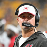 Aug 16, 2025; Pittsburgh, Pennsylvania, USA; Tampa Bay Buccaneers offensive coordinator Josh Grizzard watches the action against the Pittsburgh Steelers during the second half at Acrisure Stadium. Mandatory Credit: Barry Reeger-Imagn Images