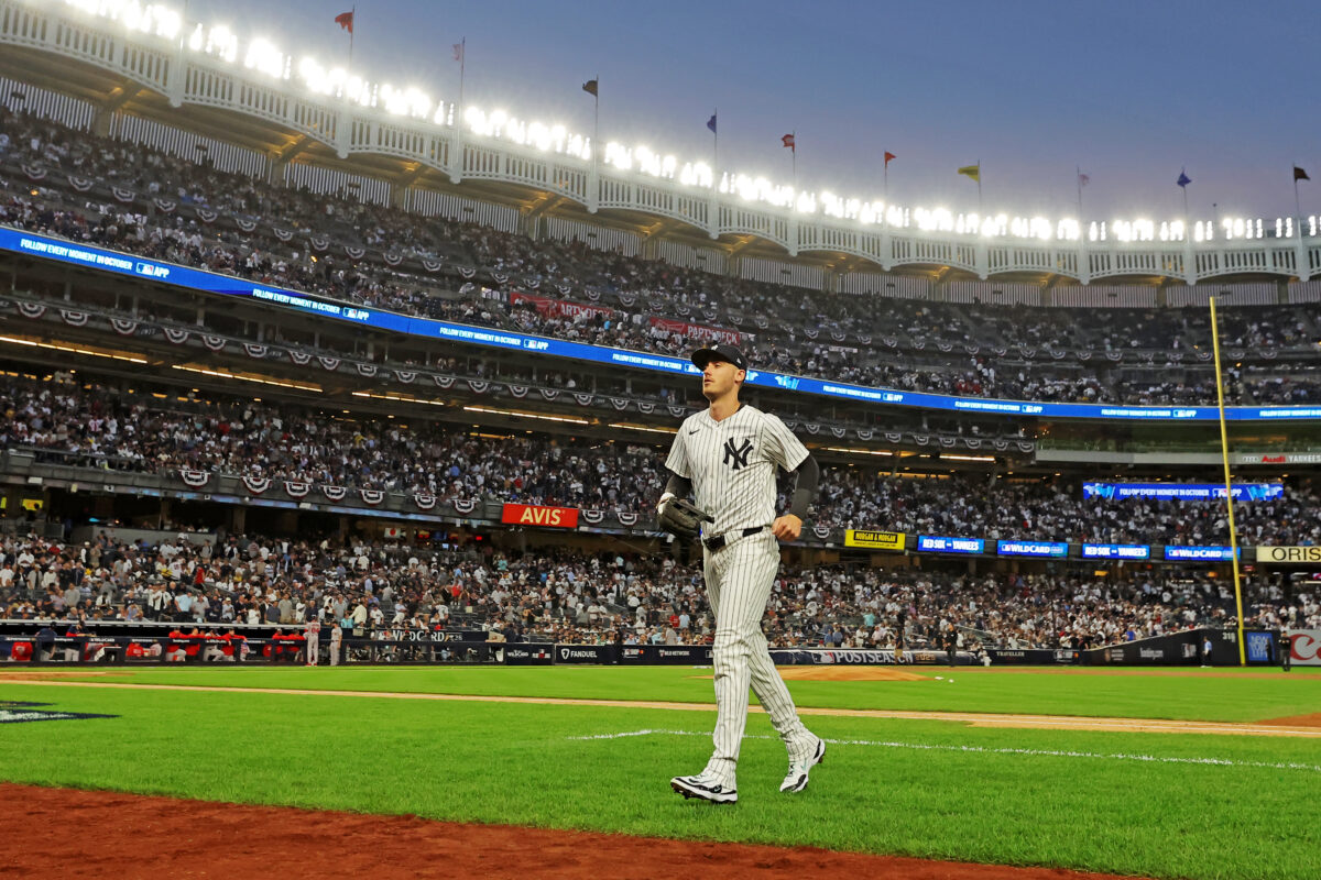 Sep 30, 2025; Bronx, New York, USA; New York Yankees outfielder Cody Bellinger (35) runs in after the top of third inning against the Boston Red Sox during game one of the Wildcard round for the 2025 MLB playoffs at Yankee Stadium. Mandatory Credit: Brad Penner-Imagn Images