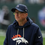 Bills Oct 12, 2025; Tottenham, United Kingdom; Denver Broncos senior offensive assistant coach Pete Carmichael watches during an NFL International Series game against the New York Jets at Tottenham Hotspur Stadium. Mandatory Credit: Kirby Lee-Imagn Images