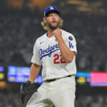 Oct 27, 2025; Los Angeles, California, USA; Los Angeles Dodgers pitcher Clayton Kershaw (22) reacts in the twelfth inning against the Toronto Blue Jays during game three of the 2025 MLB World Series at Dodger Stadium. Mandatory Credit: Jayne Kamin-Oncea-Imagn Images