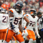Nov 2, 2025; Houston, Texas, USA; Denver Broncos linebacker Dre Greenlaw (57) reacts after a play during the first half against the Houston Texans at NRG Stadium. Mandatory Credit: Sean Thomas-Imagn Images