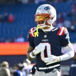 Nov 2, 2025; Foxborough, Massachusetts, USA; New England Patriots cornerback Christian Gonzalez (0) warms up before a game against the Atlanta Falcons at Gillette Stadium. Mandatory Credit: Eric Canha-Imagn Images