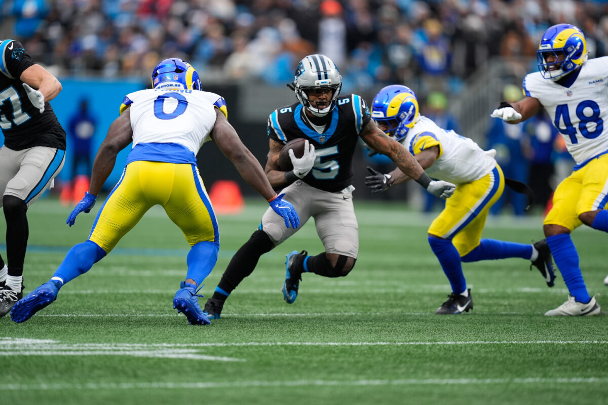 Nov 30, 2025; Charlotte, North Carolina, USA; Carolina Panthers running back Rico Dowdle (5) rushes during the second quarter against the Los Angeles Rams at Bank of America Stadium. Mandatory Credit: Jim Dedmon-Imagn Images