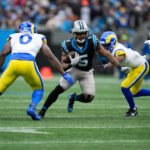 Nov 30, 2025; Charlotte, North Carolina, USA; Carolina Panthers running back Rico Dowdle (5) rushes during the second quarter against the Los Angeles Rams at Bank of America Stadium. Mandatory Credit: Jim Dedmon-Imagn Images
