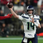 Jan 3, 2026; Santa Clara, California, USA; Seattle Seahawks quarterback Sam Darnold (14) drops back to pass against the San Francisco 49ers during the first half at Levi's Stadium. Mandatory Credit: Neville E. Guard-Imagn Images