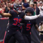 Jan 4, 2026; Houston, Texas, USA; Houston Texans linebacker Henry To'oto'o (39) reacts with safety Jalen Pitre (5) after a fumble recovery against the Indianapolis Colts during the first half at NRG Stadium. Mandatory Credit: Troy Taormina-Imagn Images