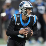 Jan 10, 2026; Charlotte, NC, USA; Carolina Panthers quarterback Bryce Young (9) drops back to pass against the Los Angeles Rams in the first half during the NFC Wild Card Round game at Bank of America Stadium. Mandatory Credit: Jim Dedmon-Imagn Images