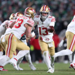 Jan 11, 2026; Philadelphia, PA, USA; San Francisco 49ers quarterback Brock Purdy (13) hands off the ball to running back Christian McCaffrey (23) against the Philadelphia Eagles during the second quarter in an NFC Wild Card Round game at Lincoln Financial Field. Mandatory Credit: Bill Streicher-Imagn Images
