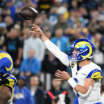 Jan 10, 2026; Charlotte, NC, USA; Los Angeles Rams quarterback Matthew Stafford (9) passes the ball in the fourth quarter in an NFC Wild Card Round game at Bank of America Stadium. Mandatory Credit: Bob Donnan-Imagn Images