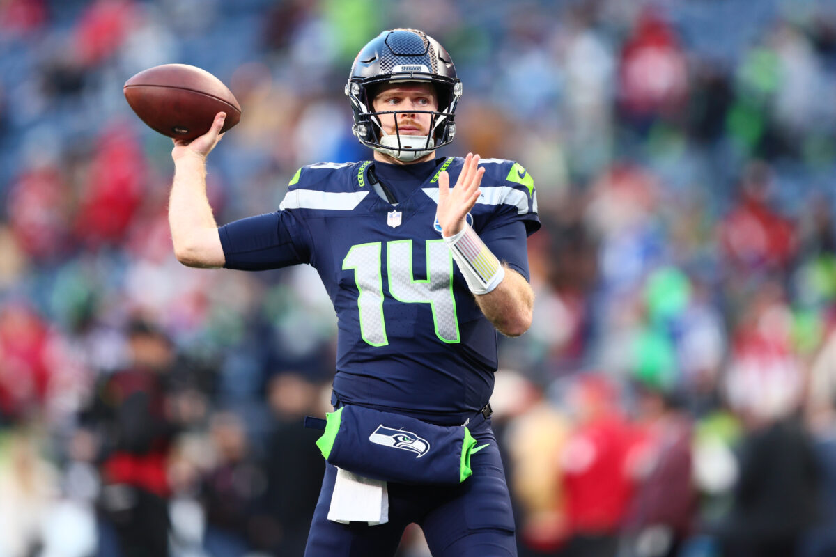 Jan 17, 2026; Seattle, WA, USA; Seattle Seahawks quarterback Sam Darnold (14) warms up prior to a game against the San Francisco 49ers in an NFC Divisional Round game at Lumen Field. Mandatory Credit: Kevin Ng-Imagn Images