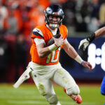 Jan 17, 2026; Denver, CO, USA; Denver Broncos quarterback Bo Nix (10) runs during the fourth quarter of an AFC Divisional Round playoff game against the Buffalo Bills at Empower Field at Mile High. Mandatory Credit: Ron Chenoy-Imagn Images