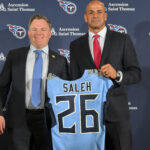 Jan 29, 2026; Nashville, TN, USA; Tennessee Titans general manager Mike Borgonzi and Tennessee Titans head coach Robert Saleh holds up the Titans jersey during the press conference at Ascension Saint Thomas Sports Park. Mandatory Credit: Steve Roberts-Imagn Images