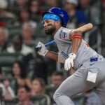 Sep 10, 2025; Cumberland, Georgia, USA; Chicago Cubs third baseman Willi Castro (1) singles against the Atlanta Braves during the sixth inning at Truist Park.