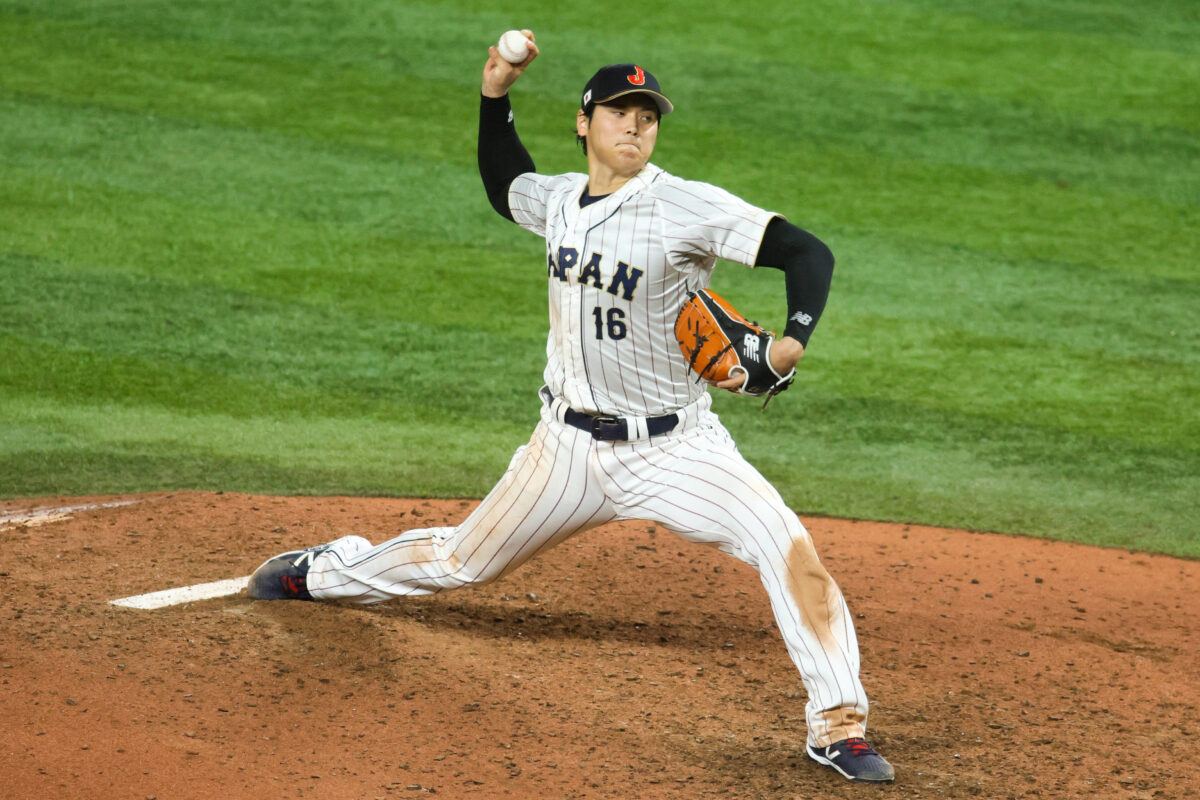 Mar 21, 2023; Miami, Florida, USA; Japan relief pitcher Shohei Ohtani (16) delivers a pitch during the ninth inning against the USA at LoanDepot Park. Mandatory Credit: Sam Navarro-USA TODAY Sports