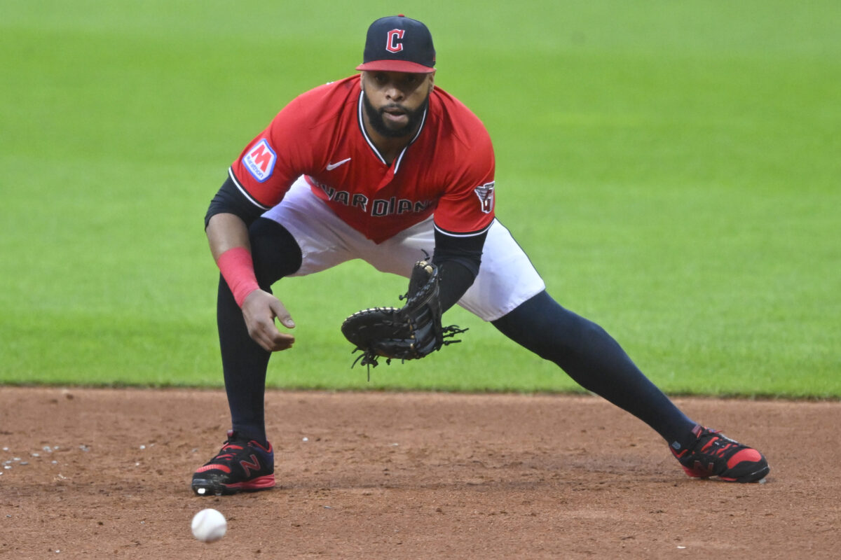 Aug 25, 2025; Cleveland, Ohio, USA; Cleveland Guardians first baseman Carlos Santana (41) fields a ground ball in the third inning against the Tampa Bay Rays at Progressive Field. Mandatory Credit: David Richard-Imagn Images