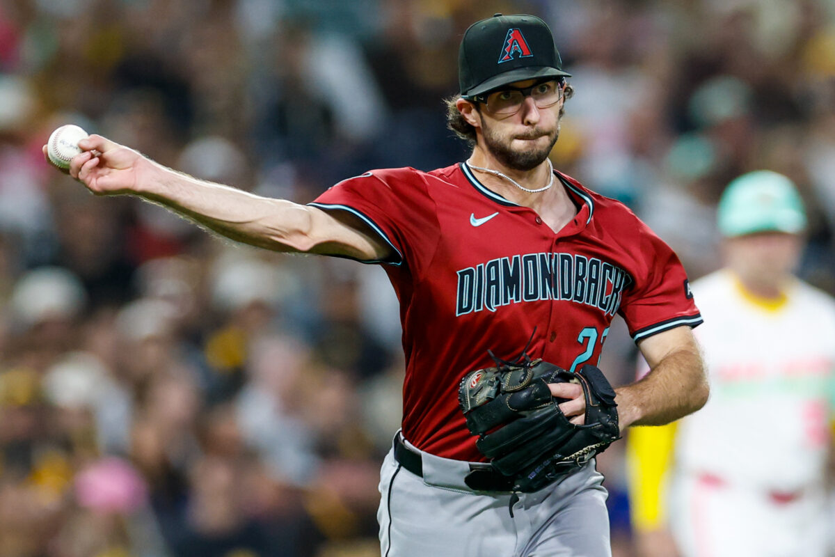 Sep 26, 2025; San Diego, California, USA; Arizona Diamondbacks starting pitcher Zac Gallen (23) throws to first base for an out during the second inning against the San Diego Padres at Petco Park. Mandatory Credit: David Frerker-Imagn Images