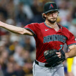 Sep 26, 2025; San Diego, California, USA; Arizona Diamondbacks starting pitcher Zac Gallen (23) throws to first base for an out during the second inning against the San Diego Padres at Petco Park. Mandatory Credit: David Frerker-Imagn Images
